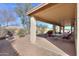 A spacious covered patio area with seating offers a serene outdoor living experience at 127 S Hancock Trl, Casa Grande, AZ 85194