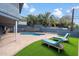 Serene backyard featuring artificial grass, lounge chairs, and a charming pool area at 1309 E Echo Ln, Phoenix, AZ 85020