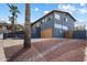 Beautiful gray two-story home with a brown garage door and manicured landscaping at 1309 E Echo Ln, Phoenix, AZ 85020