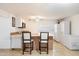 Well-lit kitchenette with an island, white cabinets, and modern appliances, ready for casual dining at 1309 E Echo Ln, Phoenix, AZ 85020