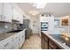 Well-lit kitchen featuring stainless steel appliances, granite countertops, and ample cabinet space at 1309 E Echo Ln, Phoenix, AZ 85020