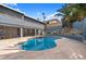 Inviting backyard with private pool and stone tile, perfect for relaxation and entertaining at 1309 E Echo Ln, Phoenix, AZ 85020