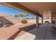 Covered back patio overlooking desert landscaping at 13208 W Desert Rock Dr, Surprise, AZ 85374