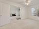 Bedroom featuring plush carpeting, white walls, and a doorway leading to a separate living area at 13208 W Desert Rock Dr, Surprise, AZ 85374