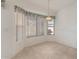 Bright dining area features large windows and hanging light fixture at 13208 W Desert Rock Dr, Surprise, AZ 85374