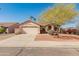 Inviting single-level home featuring a two-car garage, desert landscaping, and a warm, neutral color palette at 13208 W Desert Rock Dr, Surprise, AZ 85374