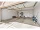 Spacious garage featuring ample storage, utility access, and clean, well-maintained concrete flooring at 13208 W Desert Rock Dr, Surprise, AZ 85374