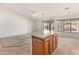 View of open floorplan, showing living room adjacent to kitchen island at 13208 W Desert Rock Dr, Surprise, AZ 85374