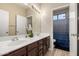 A well-lit bathroom with double vanity sinks at 13232 W Ironwood St, Surprise, AZ 85374