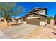 Charming two-story home with a well-maintained front yard and a two-car garage at 13232 W Ironwood St, Surprise, AZ 85374