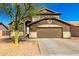 Charming two-story home with a well-maintained front yard and a two-car garage at 13232 W Ironwood St, Surprise, AZ 85374