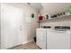 This is a bright and airy laundry room with modern appliances and ample storage space at 13232 W Ironwood St, Surprise, AZ 85374