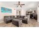 Relaxing living room featuring a comfortable sectional sofa and open access to other living spaces at 13232 W Ironwood St, Surprise, AZ 85374