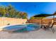 Refreshing backyard pool with clean water and easy access, surrounded by a patio area and a fenced yard at 13232 W Ironwood St, Surprise, AZ 85374