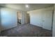 Neutral bedroom featuring grey carpet, white walls, and easy access to ensuite bathroom at 13249 E Verbina Ln, Florence, AZ 85132