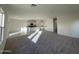 Kitchen and living room featuring an open-concept design with white cabinets at 13249 E Verbina Ln, Florence, AZ 85132