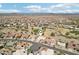 Scenic aerial view of a residential community featuring golf course, desert landscape and mountain views at 14110 W Robertson Dr, Sun City West, AZ 85375