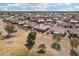 Aerial view of house on a golf course in a desert residential neighborhood at 14110 W Robertson Dr, Sun City West, AZ 85375