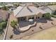 Aerial view of house with an outdoor patio and mature landscaping at 14110 W Robertson Dr, Sun City West, AZ 85375