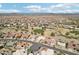 Scenic aerial view of a residential community featuring golf course, desert landscape and mountain views at 14110 W Robertson Dr, Sun City West, AZ 85375