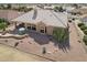 Aerial view of house with a desert landscaped backyard and an outdoor patio set at 14110 W Robertson Dr, Sun City West, AZ 85375