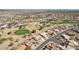 Scenic aerial view of a residential community featuring golf course, desert landscape and mountain views at 14110 W Robertson Dr, Sun City West, AZ 85375