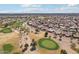 Aerial view of a desert golf course community with mountains in the distance at 14110 W Robertson Dr, Sun City West, AZ 85375