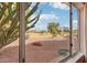 Panoramic backyard view highlighting lush desert landscaping and scenic golf course at 14110 W Robertson Dr, Sun City West, AZ 85375