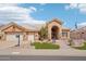 Inviting single-story home featuring a manicured desert landscape, paver walkway, and a classic tiled roof at 14110 W Robertson Dr, Sun City West, AZ 85375