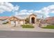 Charming single-story home with a well-manicured desert landscape, beautiful walkway, and a welcoming arched entryway at 14110 W Robertson Dr, Sun City West, AZ 85375