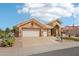 Single-story home with desert landscaping, mature cacti, an arched entry, and a spacious two-car garage at 14110 W Robertson Dr, Sun City West, AZ 85375