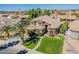 Stunning two-story home featuring well-kept lawn and mature palm tree at 1446 E Oxford Ln, Gilbert, AZ 85295