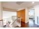 Bright hallway with wood floors leading to bedrooms at 1446 E Oxford Ln, Gilbert, AZ 85295