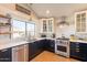 Stylish kitchen with stainless steel appliances and bright subway tile backsplash at 1446 E Oxford Ln, Gilbert, AZ 85295