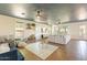 Sunlit living room with decorative rug, comfortable seating, and bright windows at 1446 E Oxford Ln, Gilbert, AZ 85295