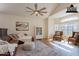 Staged living room, with comfortable armchairs, enhancing the space's appeal at 1446 E Oxford Ln, Gilbert, AZ 85295