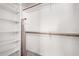 Walk-in closet featuring built in shelving and plentiful storage space at 14957 W Bottle Tree Ave, Surprise, AZ 85374