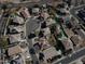 Aerial view of a neighborhood featuring desert landscaping and backyard swimming pools at 15137 W Yucatan Dr, Surprise, AZ 85379