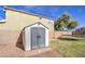 A backyard shed in a well-maintained grassy area with a trampoline at 15137 W Yucatan Dr, Surprise, AZ 85379