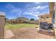 A large backyard features a pergola, shed, and covered patio at 15137 W Yucatan Dr, Surprise, AZ 85379