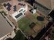 Aerial view of a backyard with a lawn, shed, pergola and trampoline at 15137 W Yucatan Dr, Surprise, AZ 85379