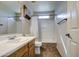 Bathroom featuring a shower and tub combination, a single sink vanity, and neutral tones at 15137 W Yucatan Dr, Surprise, AZ 85379