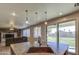 Modern kitchen featuring an island sink with overhead lighting and stainless steel appliances at 15137 W Yucatan Dr, Surprise, AZ 85379