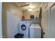 Functional laundry room with modern washer and dryer at 15137 W Yucatan Dr, Surprise, AZ 85379