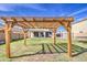 Backyard pergola providing shade and a view of the home at 15137 W Yucatan Dr, Surprise, AZ 85379