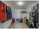 Walk-in closet with organized shelving and plenty of space for clothing and shoes at 15137 W Yucatan Dr, Surprise, AZ 85379