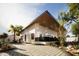 Beautiful, modern home featuring desert landscaping and a concrete paved driveway at 15674 S Overfield Rd, Arizona City, AZ 85123