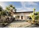 Charming single-story home featuring a well-manicured front yard and a stylish stone facade at 15674 S Overfield Rd, Arizona City, AZ 85123