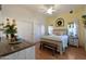 A beautifully styled bedroom featuring lots of light, a ceiling fan, and access to the backyard at 16546 E Ashbrook Dr # A, Fountain Hills, AZ 85268