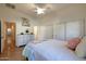 Bright bedroom features a ceiling fan, closet, and neutral tones perfect for relaxation at 16546 E Ashbrook Dr # A, Fountain Hills, AZ 85268